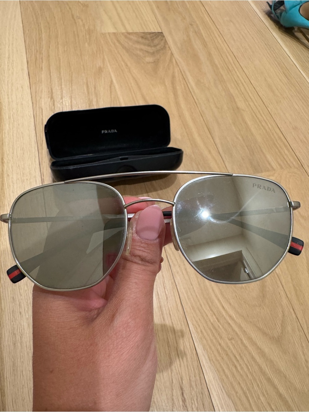 Prada Silver Linea Rossa Frame Sunglasses with mirrored Lenses